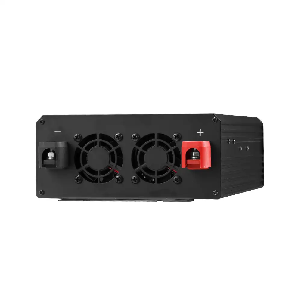 This black 1500W Pure Sine Wave Inverter with LCD Display features two cooling fans and visible red positive and black negative battery terminals.