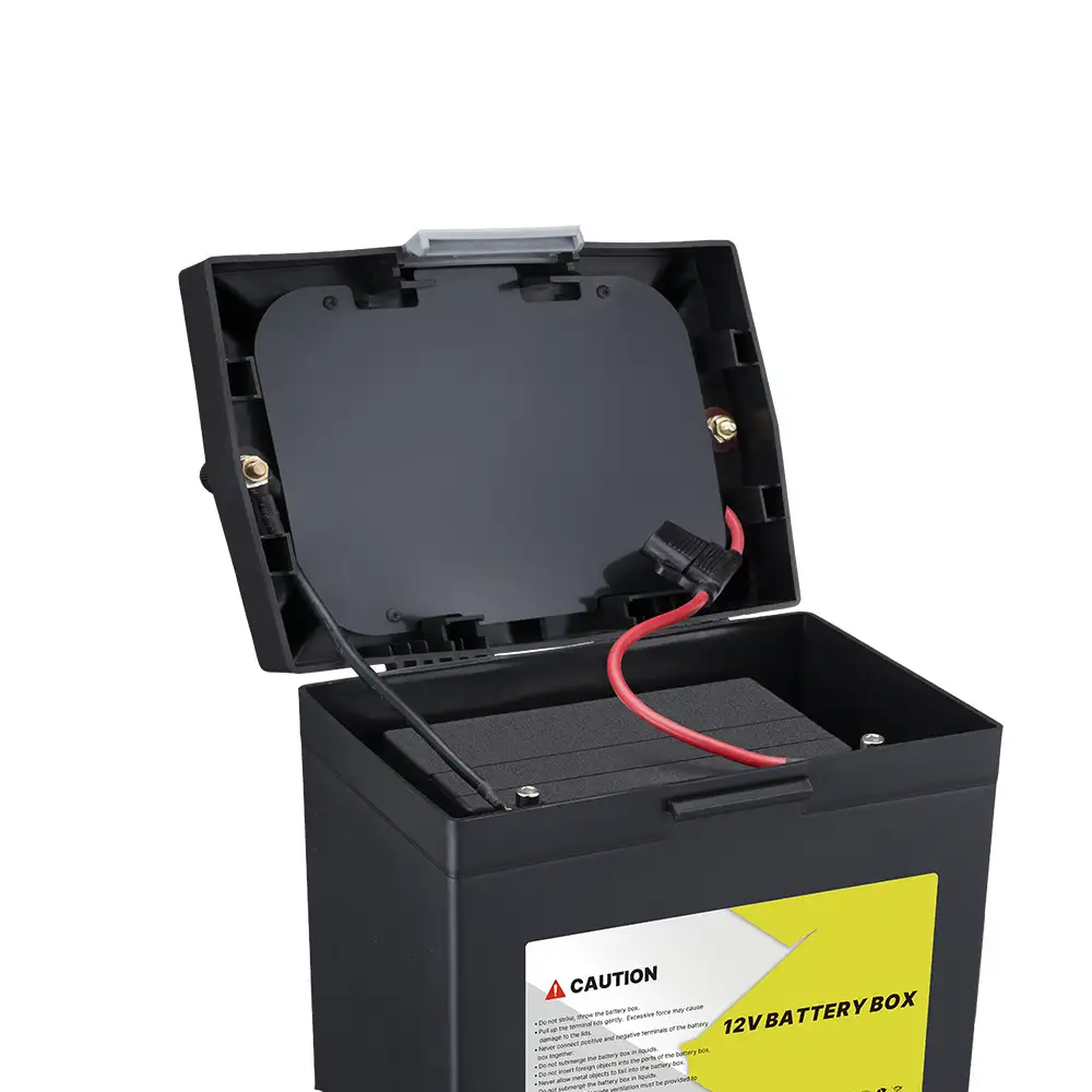 Interior view of the Compact 12V Battery Box with PD30W Multi-Port DC Output showing the open black lid, red wiring, and caution label.